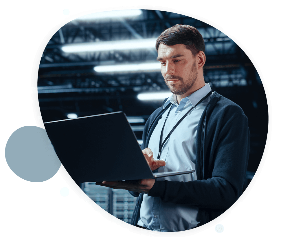 cci_panoptic_data-center_hero_man-laptop-make-data-work-warehouse-2